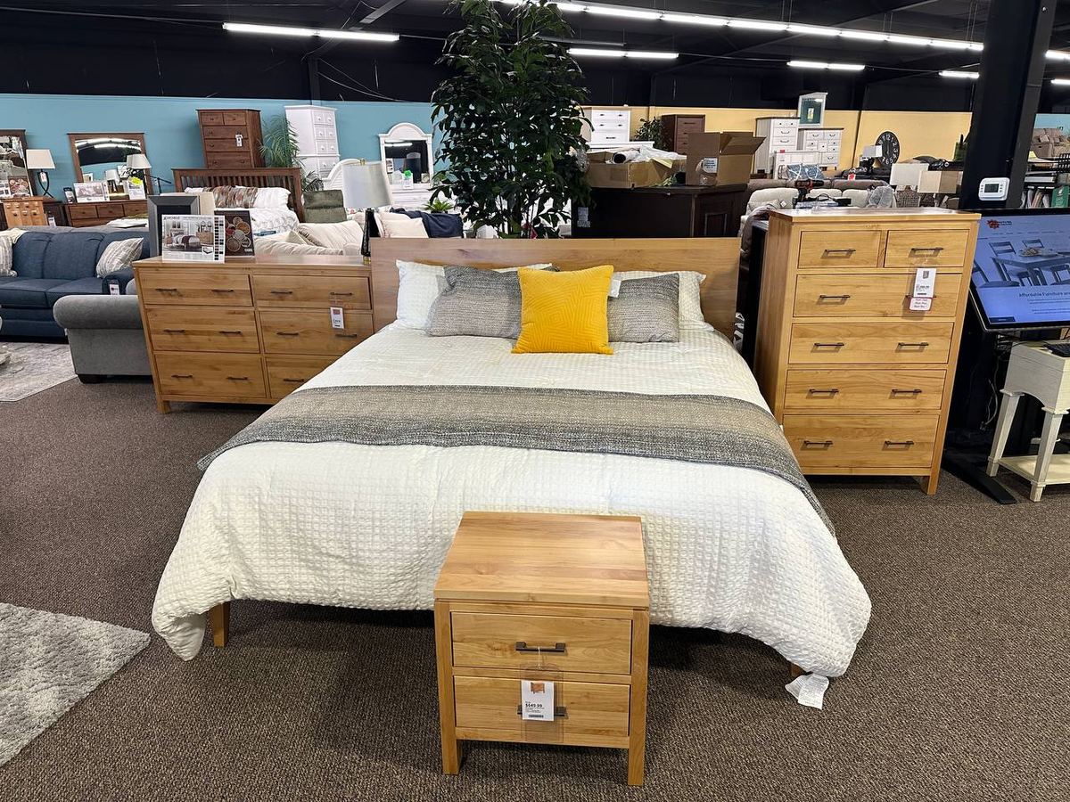 Archbold 2 West Bedroom Collection in a warm natural wood finish at the Newport showroom