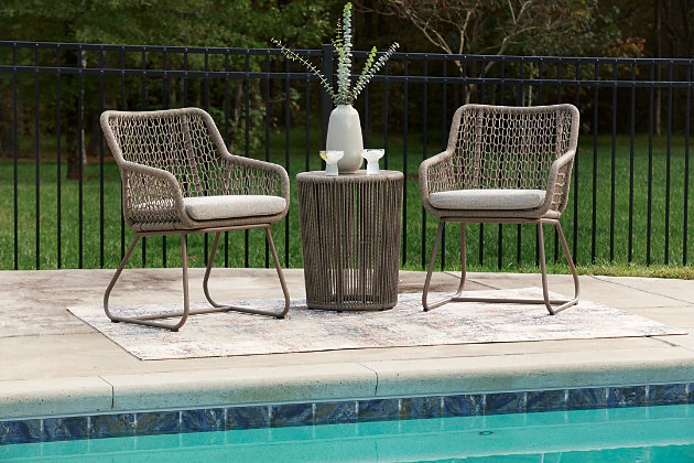 Majors Beach two chairs and table by a pool